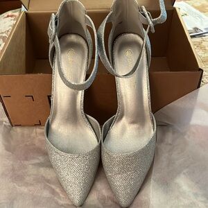 Silver shimmery chunk heel pointed toe dress shoes. Size 8.5